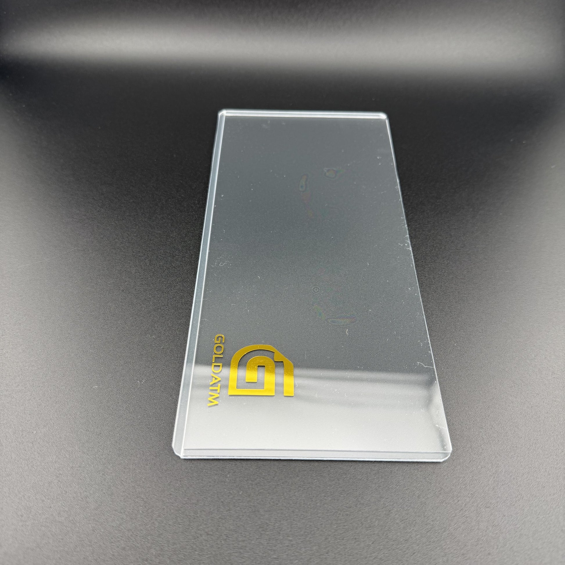 Empty Goldback PVC Bill Holder upright at an angle showing the gold foil GoldATM logo